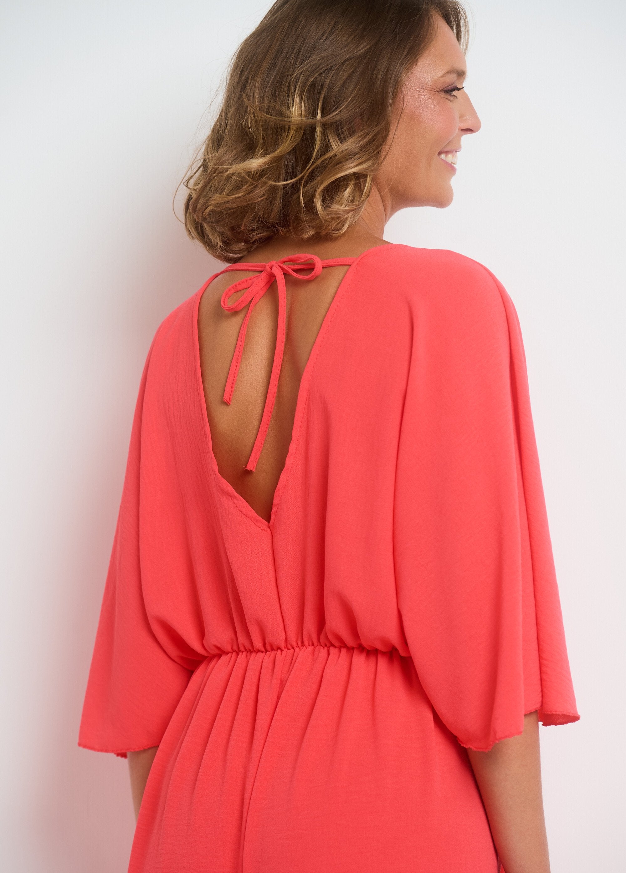 Fluid_V-neck_jumpsuit_with_tie_back_Coral_DE3_slim